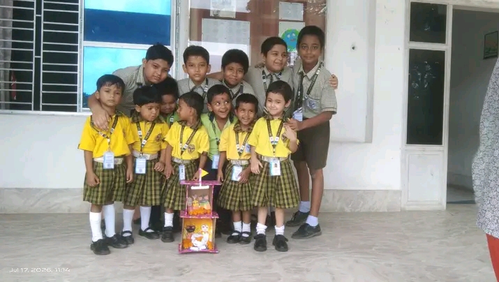 Students of The Zion Public School in the school uniform — yellow shirts with green and yellow checked bottoms